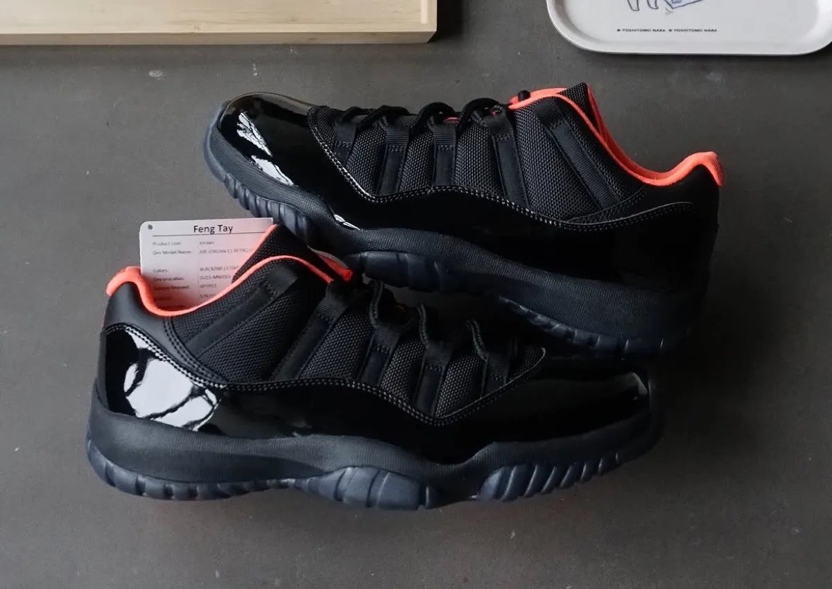 Air Jordan 11 Low Black Infrared sample featuring all-black patent leather upper with infrared sockliner and Jumpman branding - detail view 2