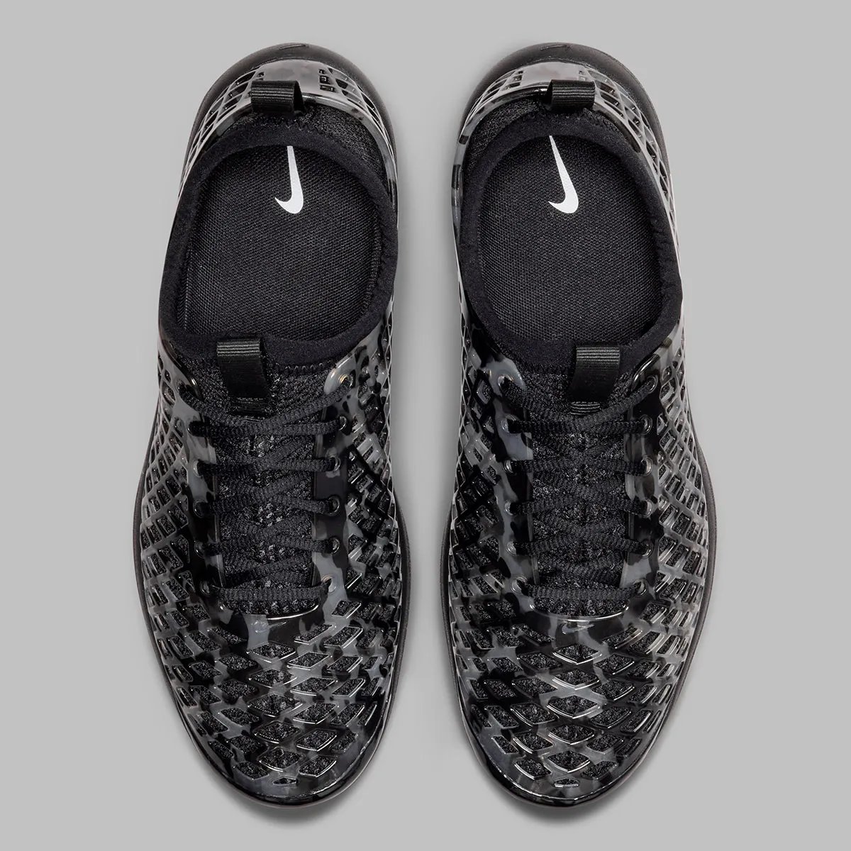 Nike Air Rejuven8 Camo Pack in Black/White and Barkroot Brown colorways with semi-opaque material and diamond camo pattern - detail view 5