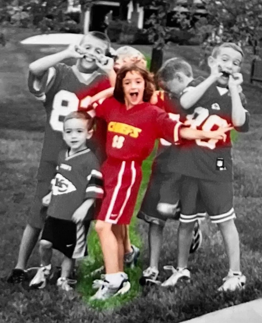 Nike Caitlin 1 Chiefs colorway in red and gold, featuring oversized Swoosh and metallic tongue branding - detail view 2