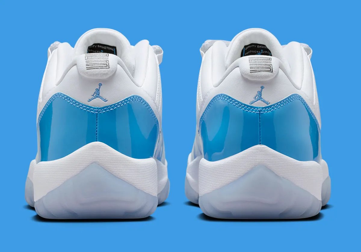 Air Jordan 11 Low in University Blue and white, showing mudguard detail and icy translucent sole - detail view 4