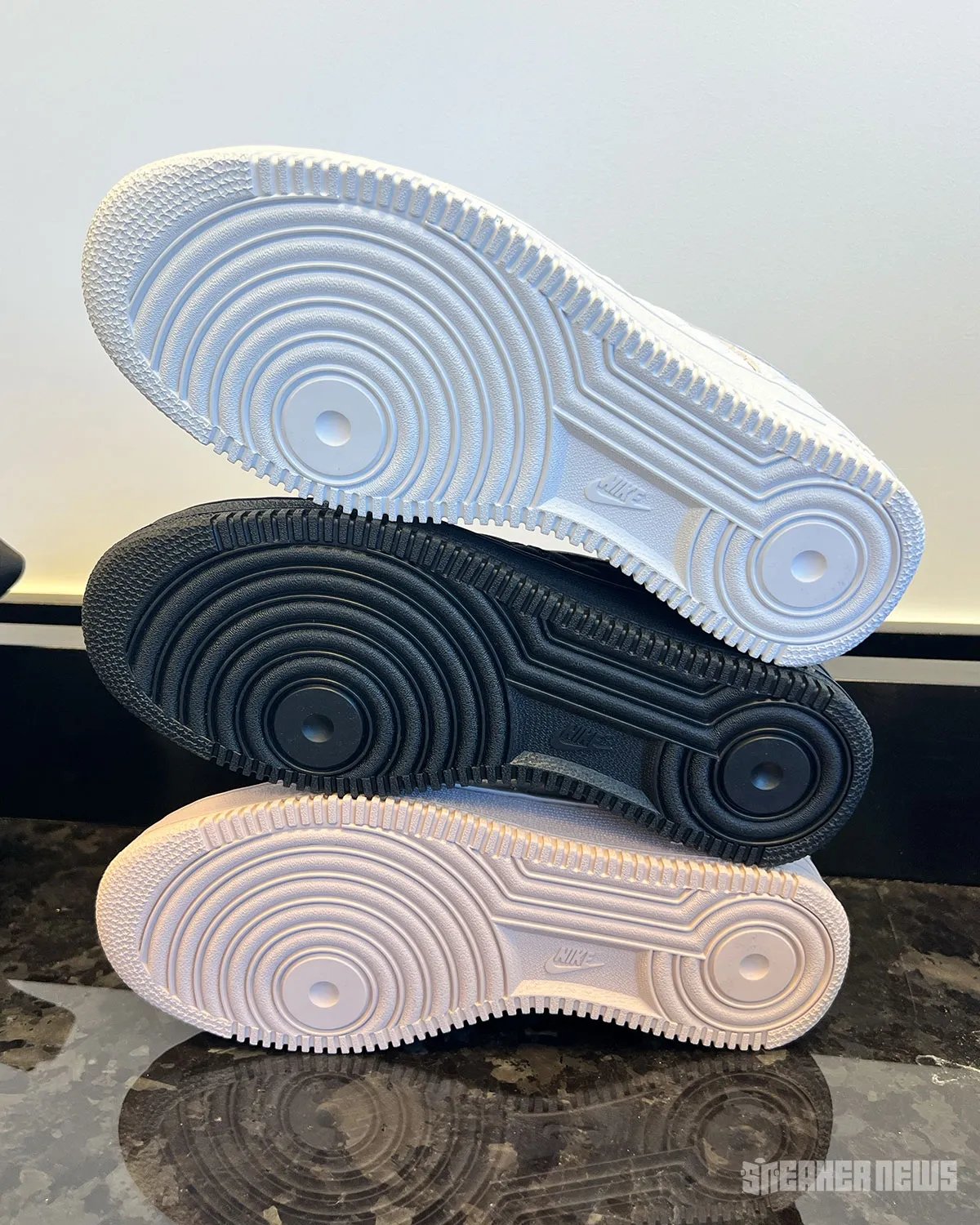 Nike Air Force 1 Low Quilted in triple white, featuring crosstitch detailing across the upper and matte leather collar - detail view 4