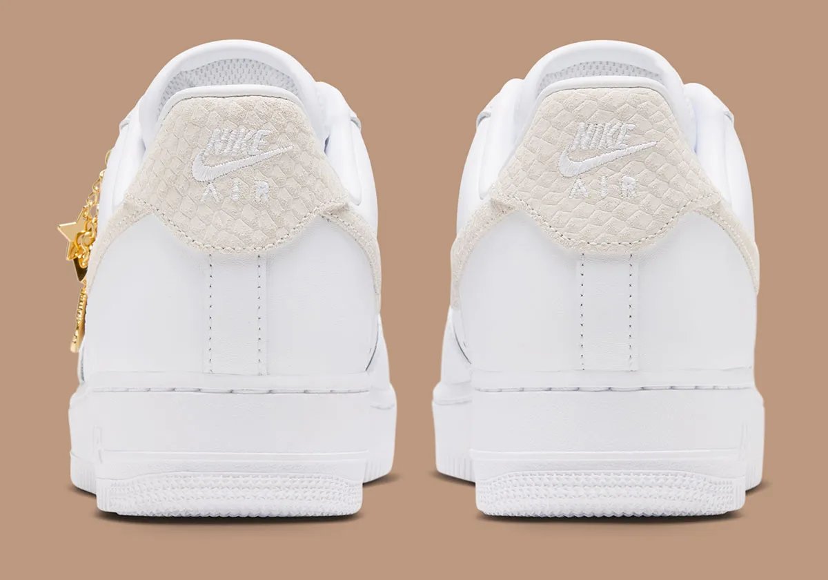 Women's Nike Air Force 1 Low in white leather with tan snakeskin Swoosh and detachable golden charm accessories - detail view 4