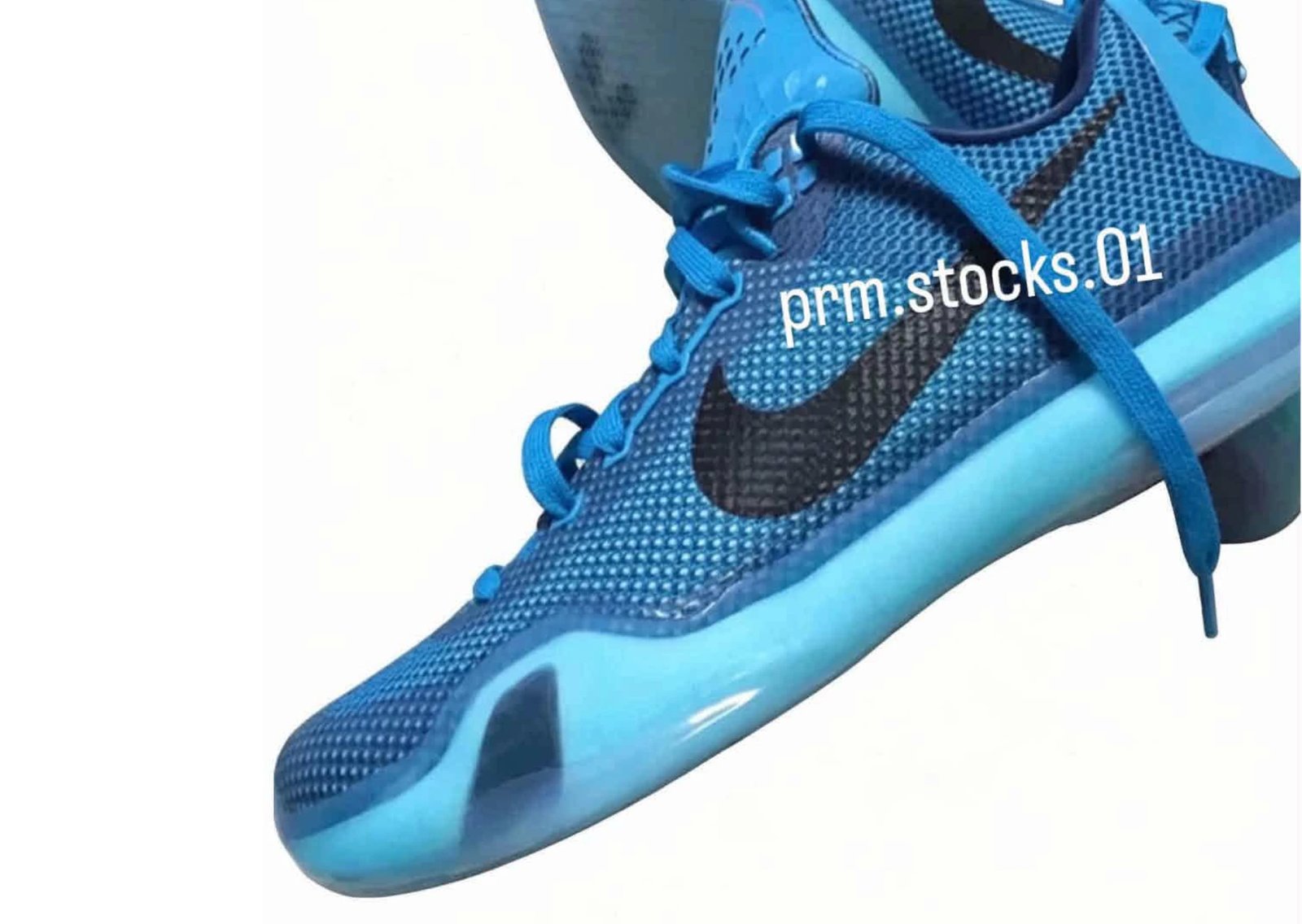 Nike Kobe 10 EM Protro 5 AM Flight featuring Blue Lagoon engineered mesh upper with black Swoosh and red heel stitching detail - detail view 1