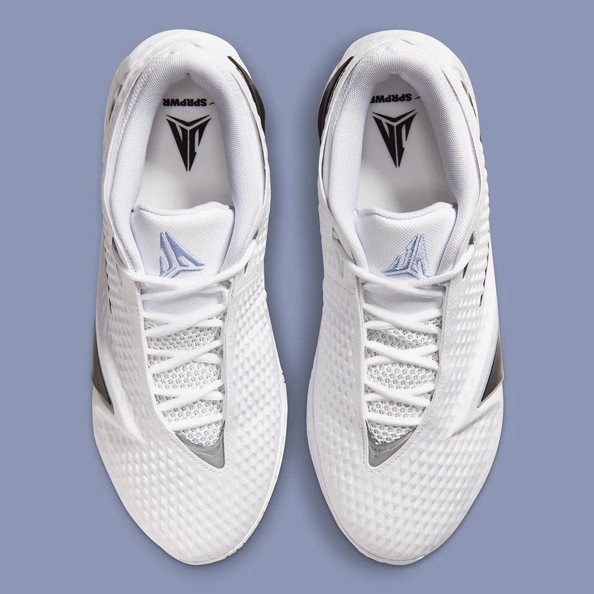 Nike Ja 4 in White with Cobalt Bliss, Photon Dust, and Black colorway, showing the white upper, black Swoosh, and A-Frame detail - detail view 3