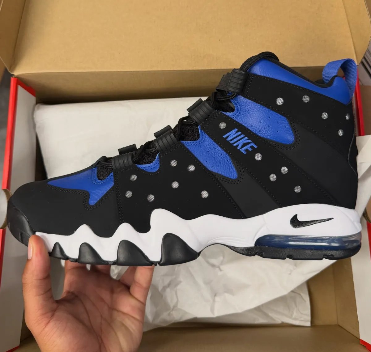 Nike Air Max2 CB '94 Varsity Royal in black nubuck with royal blue leather panels and white midsole, showing the characteristic cutout design and jagged outsole sections - detail view 2