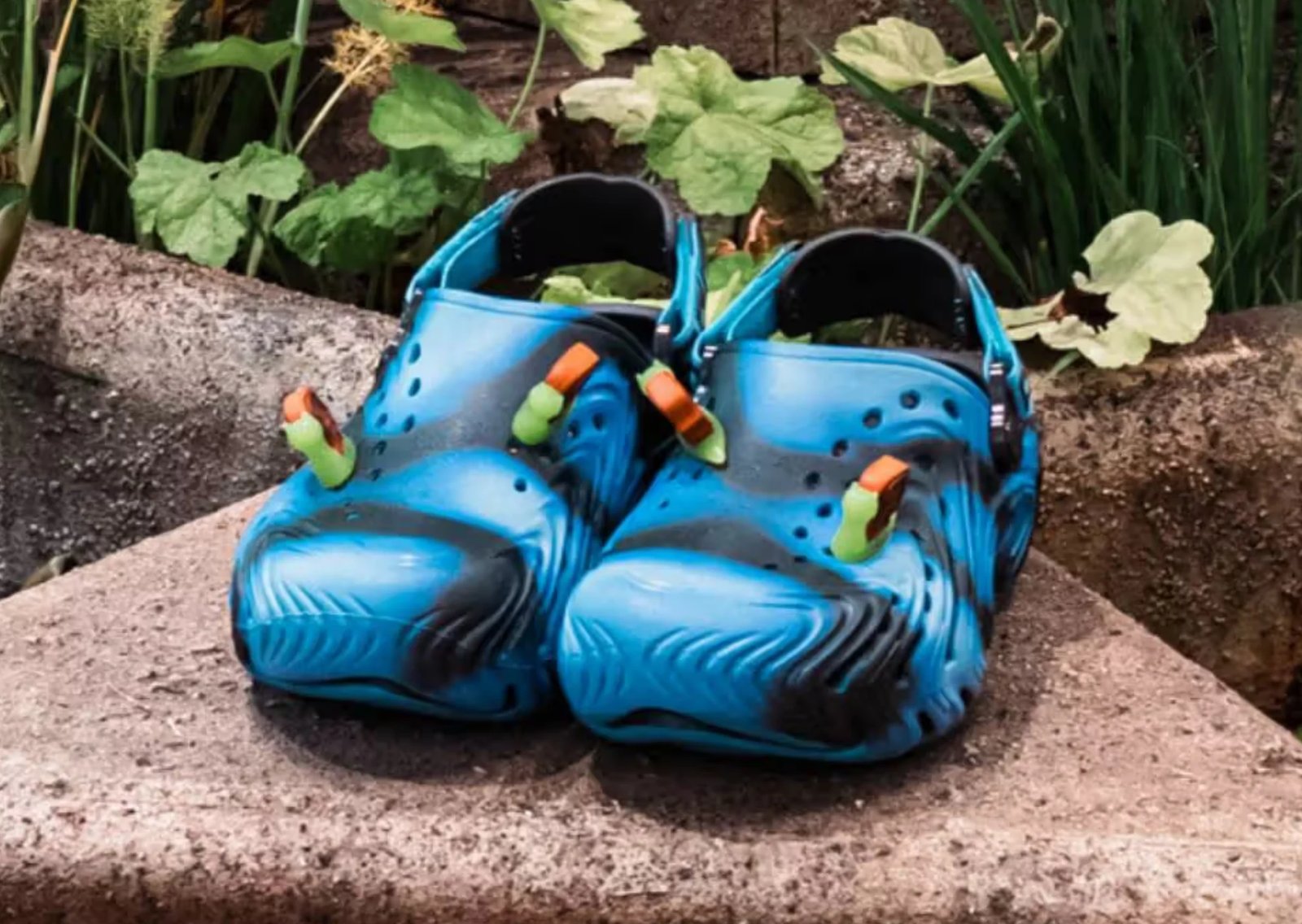 Brain Dead x Crocs Echo II in tide-pool blue and black with co-branded heel strap and neon green Jibbitz - detail view 2