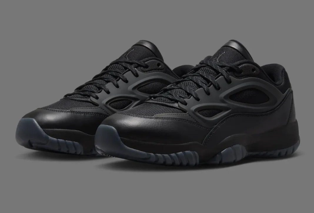 Jordan DMSN 95 in Black/Dark Smoke Grey showing mesh upper and molded TPU cage detail - detail view 1
