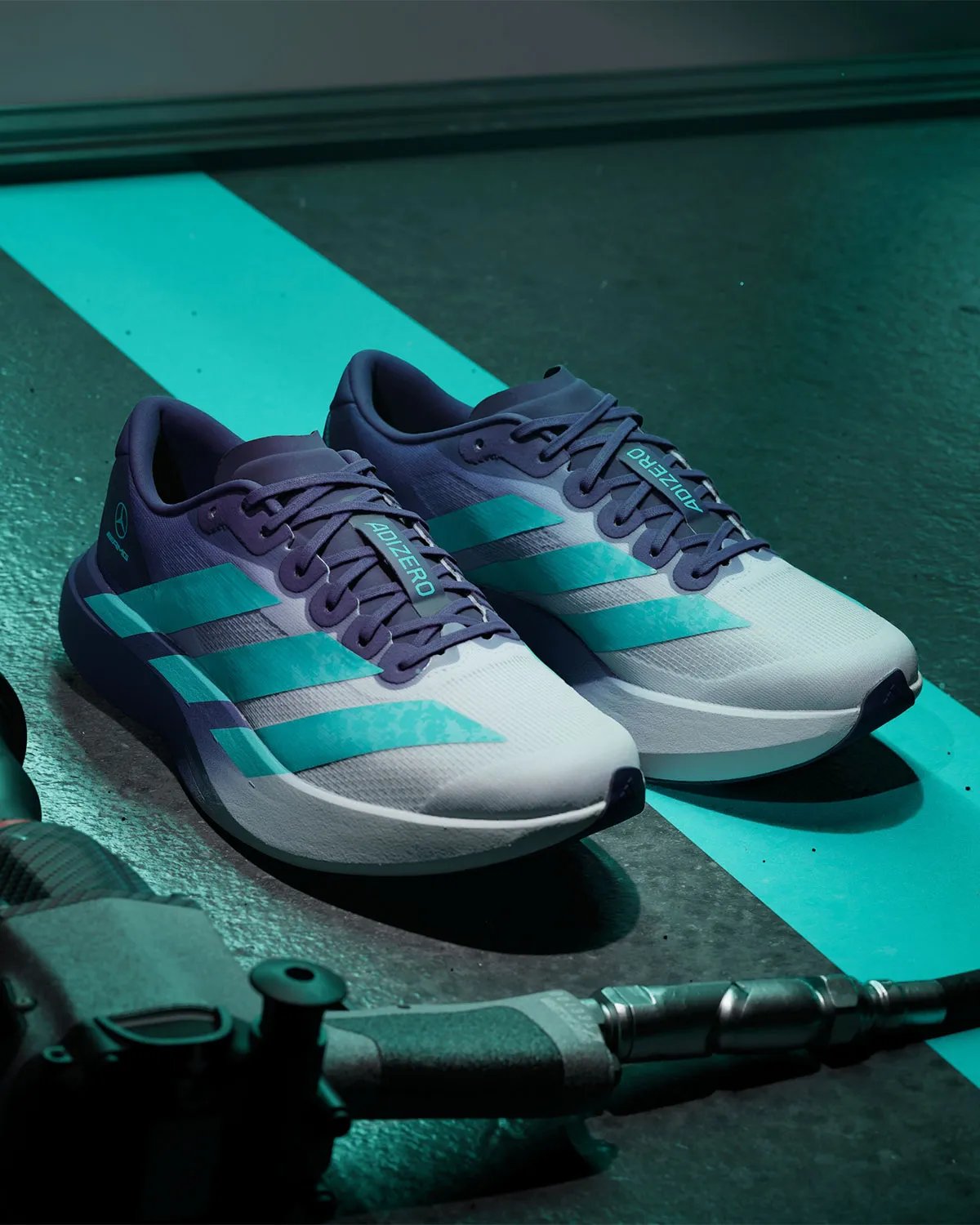 Mercedes AMG Petronas F1 x adidas adiZero EVO SL in Vanda orchid purple gradient with hi-vis teal Three Stripes accents - detail view 1