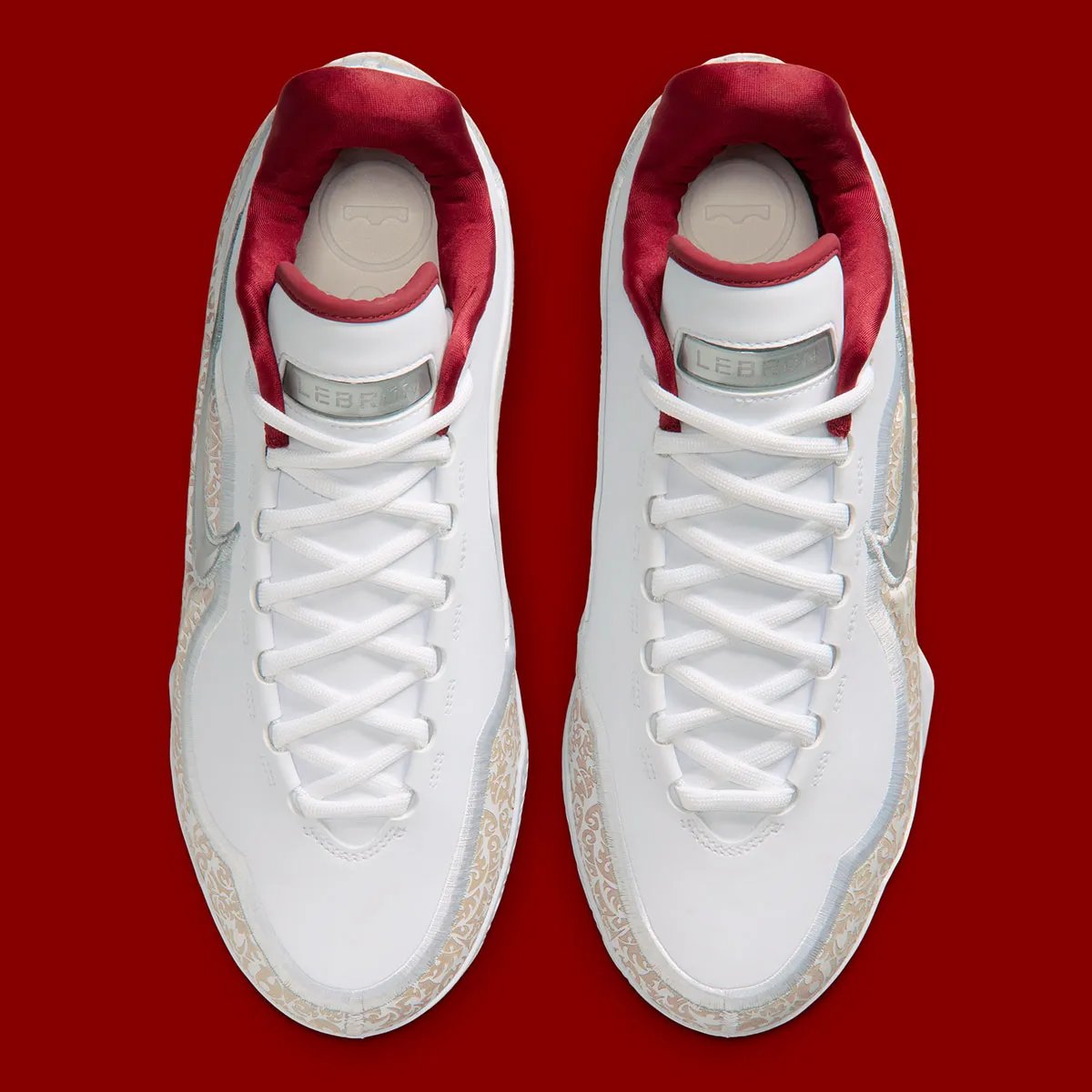 Nike LeBron 23 'Laser' colorway with white upper, laser-etched crown shell, and red satin interior lining - detail view 4
