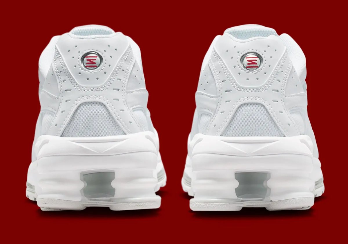 Nike Shox Ride 2 in Triple White colorway, showing full white upper, midsole, and visible Shox cushioning units - detail view 4