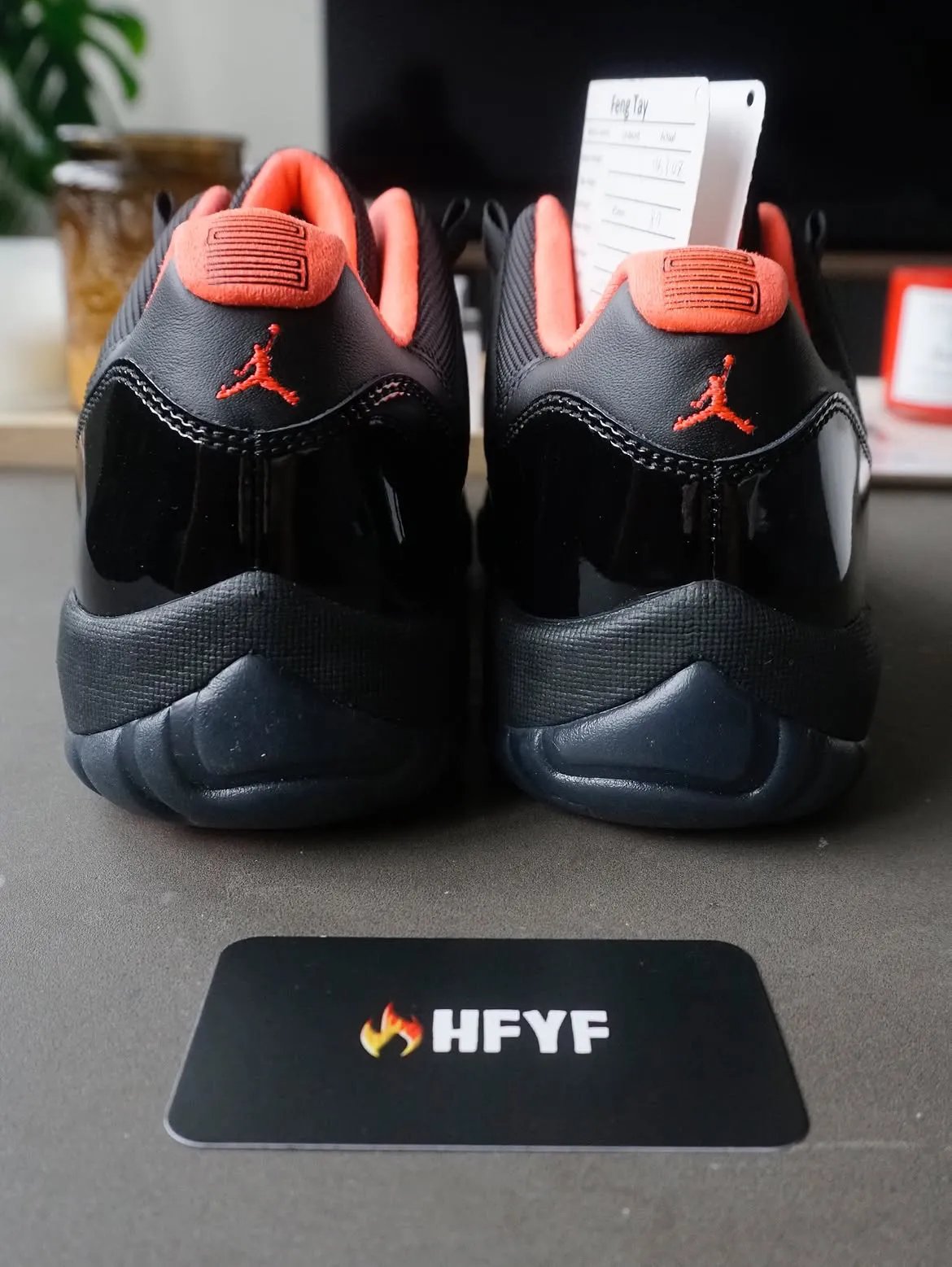 Air Jordan 11 Low Black Infrared sample featuring all-black patent leather upper with infrared sockliner and Jumpman branding - detail view 5