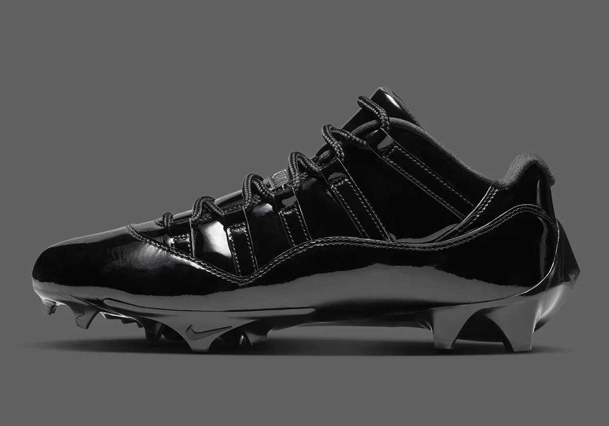 Air Jordan 11 Football Cleat in Anthracite colorway with patent leather collar and carbon fiber shank detail - detail view 1