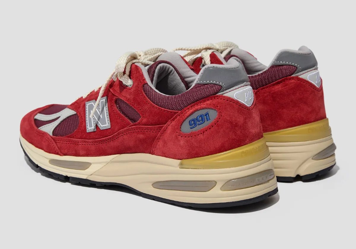 New Balance 991v2 in Karanda Red colorway featuring burgundy mesh and suede upper - detail view 1