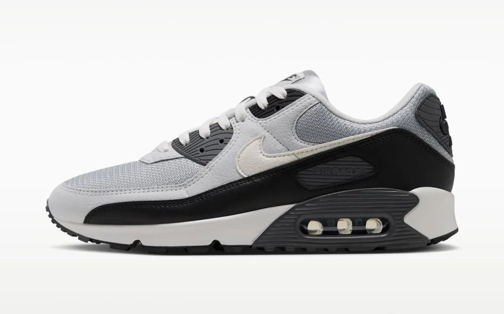Nike Air Max 90 in Iron Grey with OG-inspired color-blocking across the upper and segmented Air Max heel unit