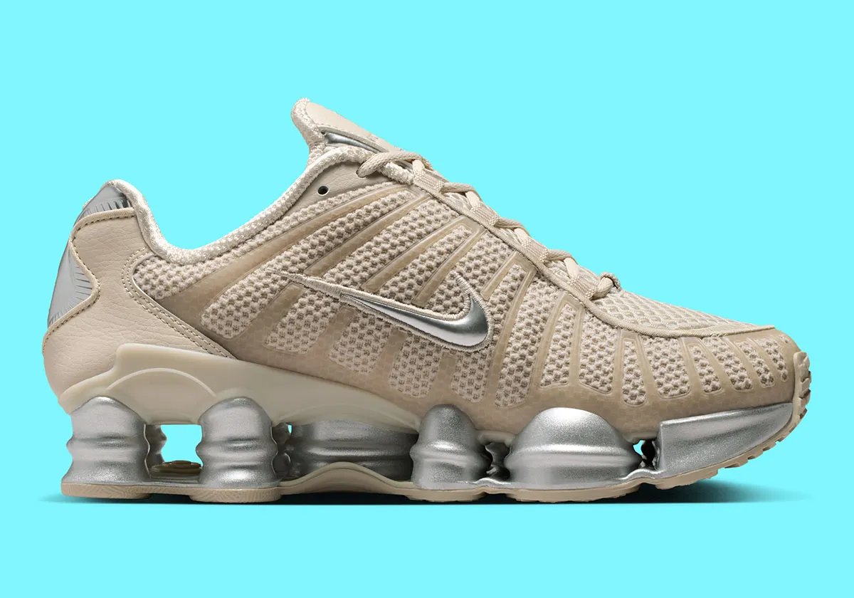 Nike Shox TL in cream base color with metallic silver accents and reflective detailing - detail view 3