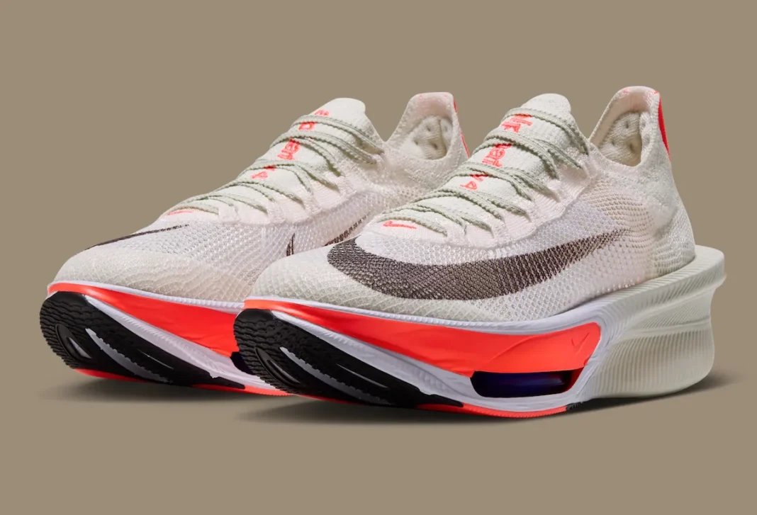 Nike AlphaFly 4 in Sea Glass and Laser Crimson with ZoomX cushioning visible in midsole, official product imagery