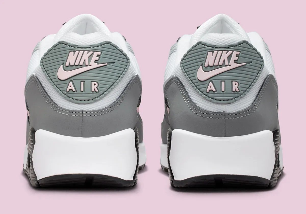 Nike Air Max 90 in Pink Foam colorway with visible Air unit and curved Swoosh geometry - detail view 4