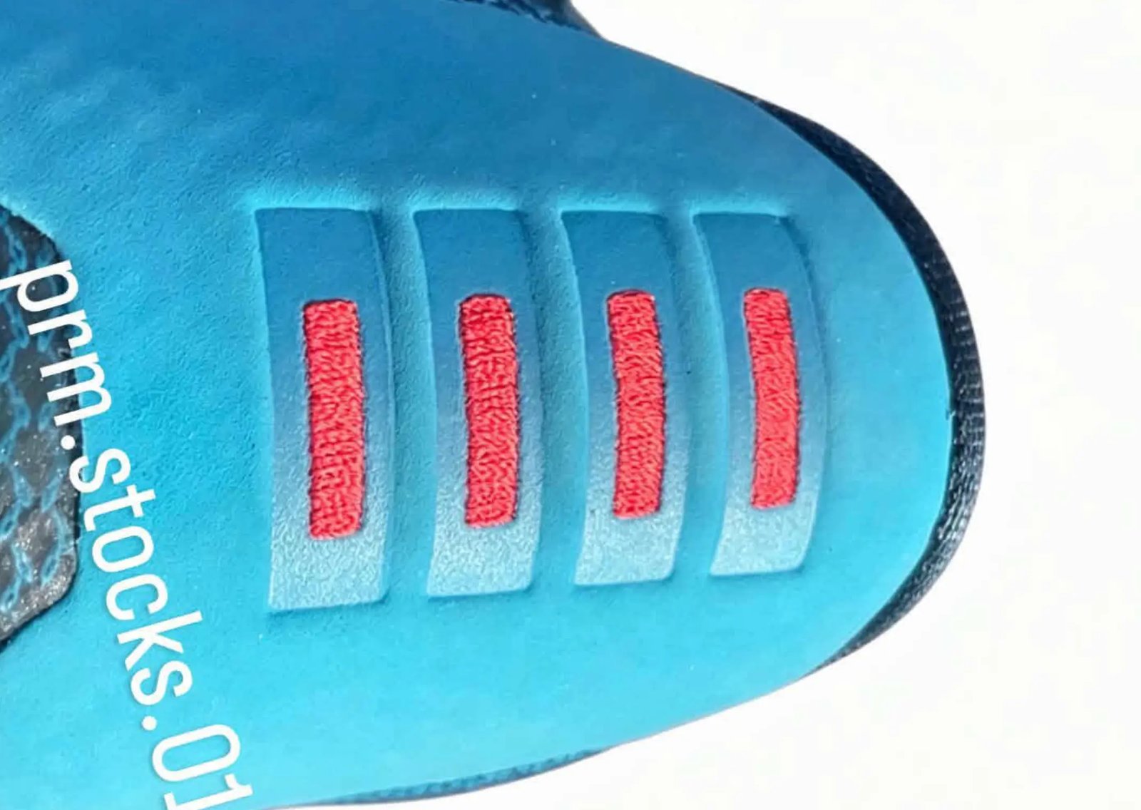 Nike Kobe 10 EM Protro 5 AM Flight featuring Blue Lagoon engineered mesh upper with black Swoosh and red heel stitching detail - detail view 3