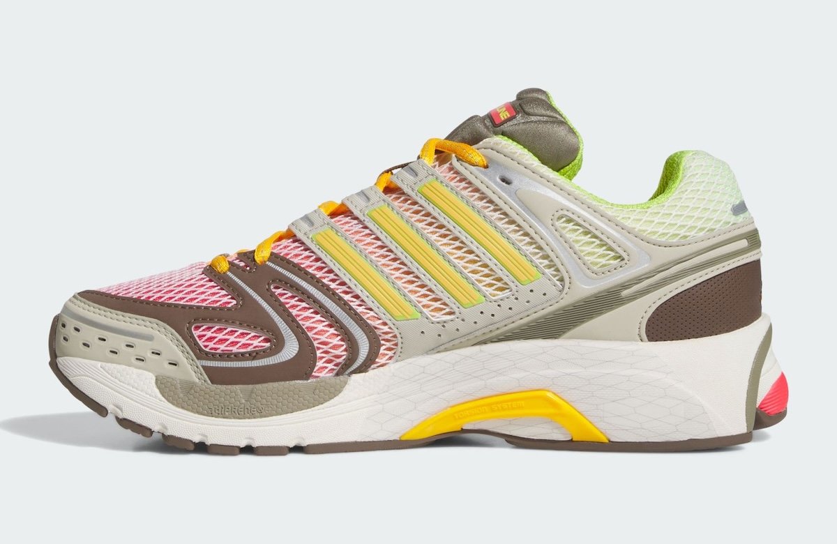 Larry June x adidas Adistar Control 5 collaboration in Semi Lucid Red and Semi Solar Slime-Clay, featuring layered grey and beige upper with green, orange, and red accents - detail view 3
