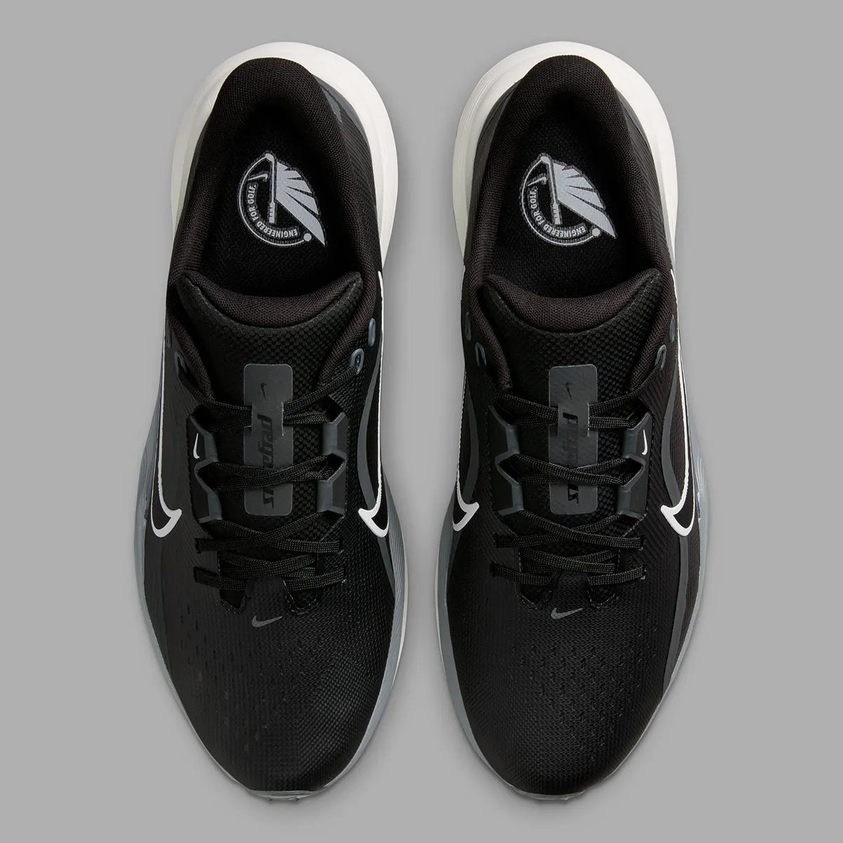 Nike Pegasus 1 Golf in black colorway, showing lateral support plates and hybrid traction system - detail view 4