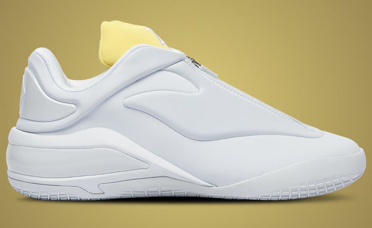 Converse Shai 001 in ghost white with yellow accents, side profile view