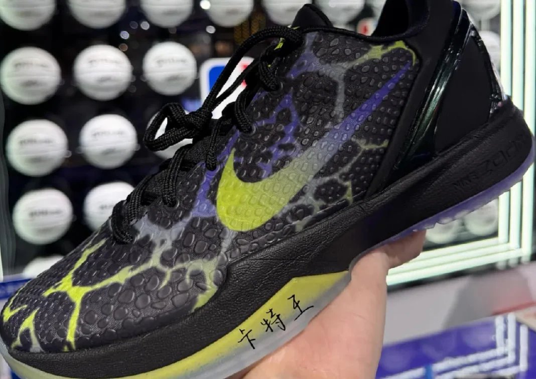 Nike Kobe 6 Protro 'Coals' in black with Venom Green and Purple Venom accents, shown in-hand with scaled upper and translucent outsole