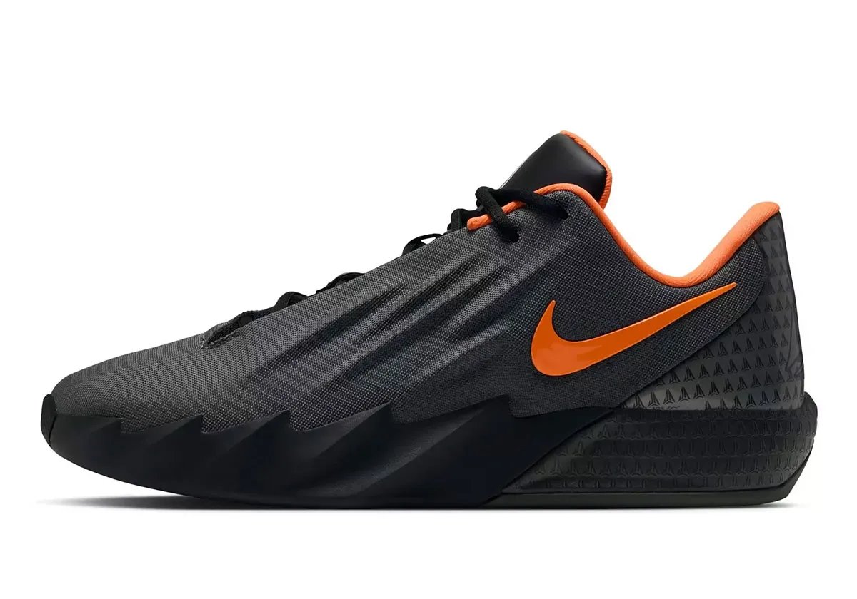 Nike Twelve Time in Black/Iron Grey/Orange colorway, Ja Morant signature takedown basketball shoe with burnt orange Swoosh and matte grey upper - detail view 1