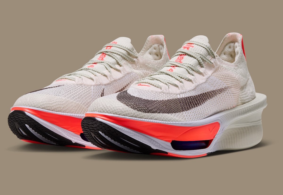 Nike AlphaFly 4 in Sea Glass and Laser Crimson with ZoomX cushioning visible in midsole, official product imagery - detail view 2