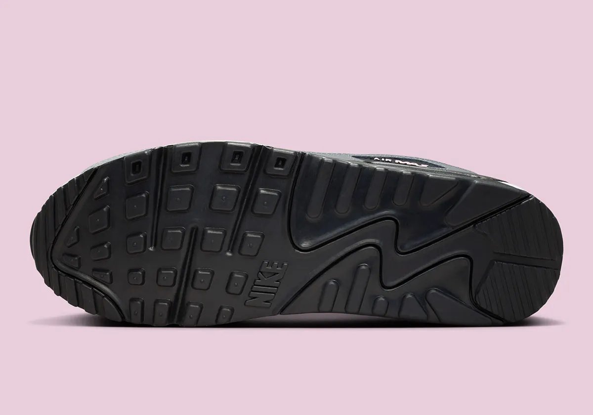 Nike Air Max 90 in Pink Foam colorway with visible Air unit and curved Swoosh geometry - detail view 5