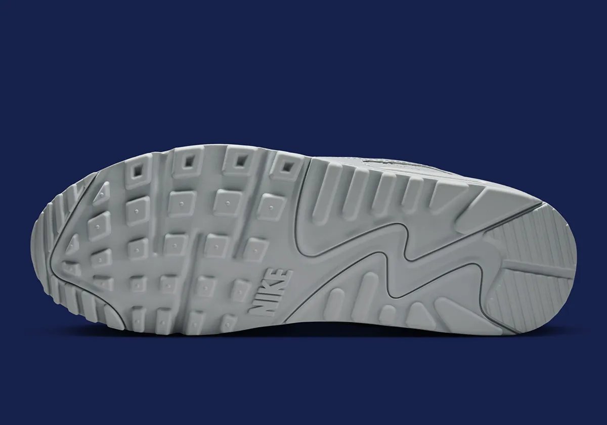 Nike Air Max 90 in team-aligned colorway styled for stadium wear - detail view 5