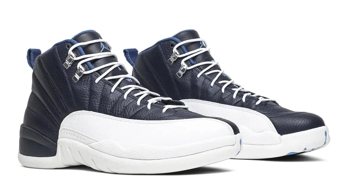 Air Jordan 12 Obsidian in navy leather with white mudguard and Carolina blue accents, releasing January 2027 - detail view 3