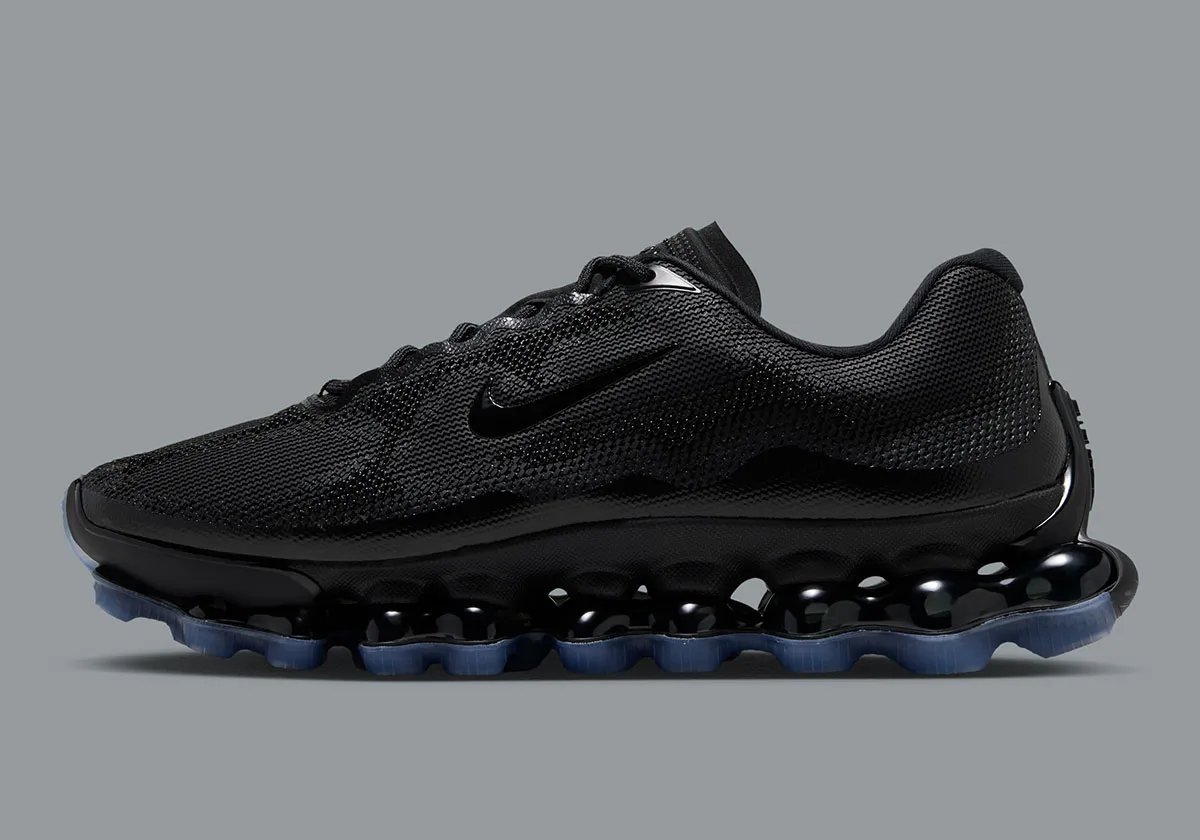 Nike Air Liquid Max in Black/Clear colorway, featuring translucent blue midsole - detail view 1