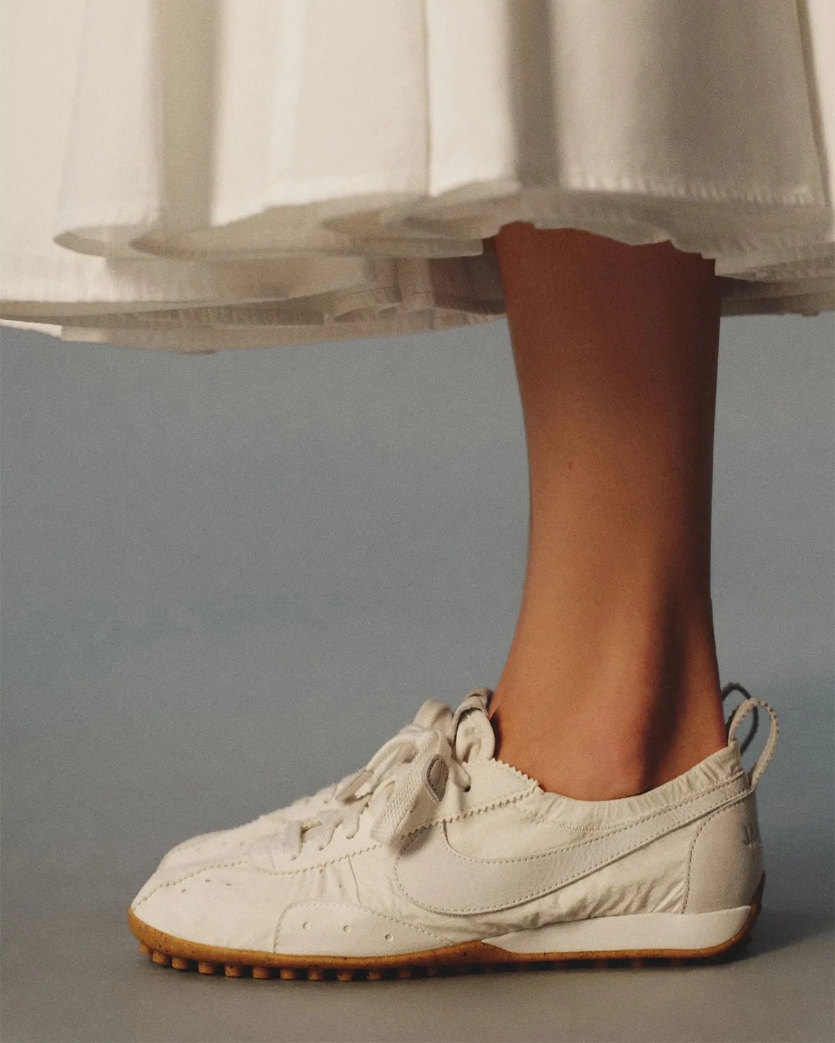 Nike x Jacquemus Moon Shoe collaboration featuring refined proportions and streamlined silhouette - detail view 4