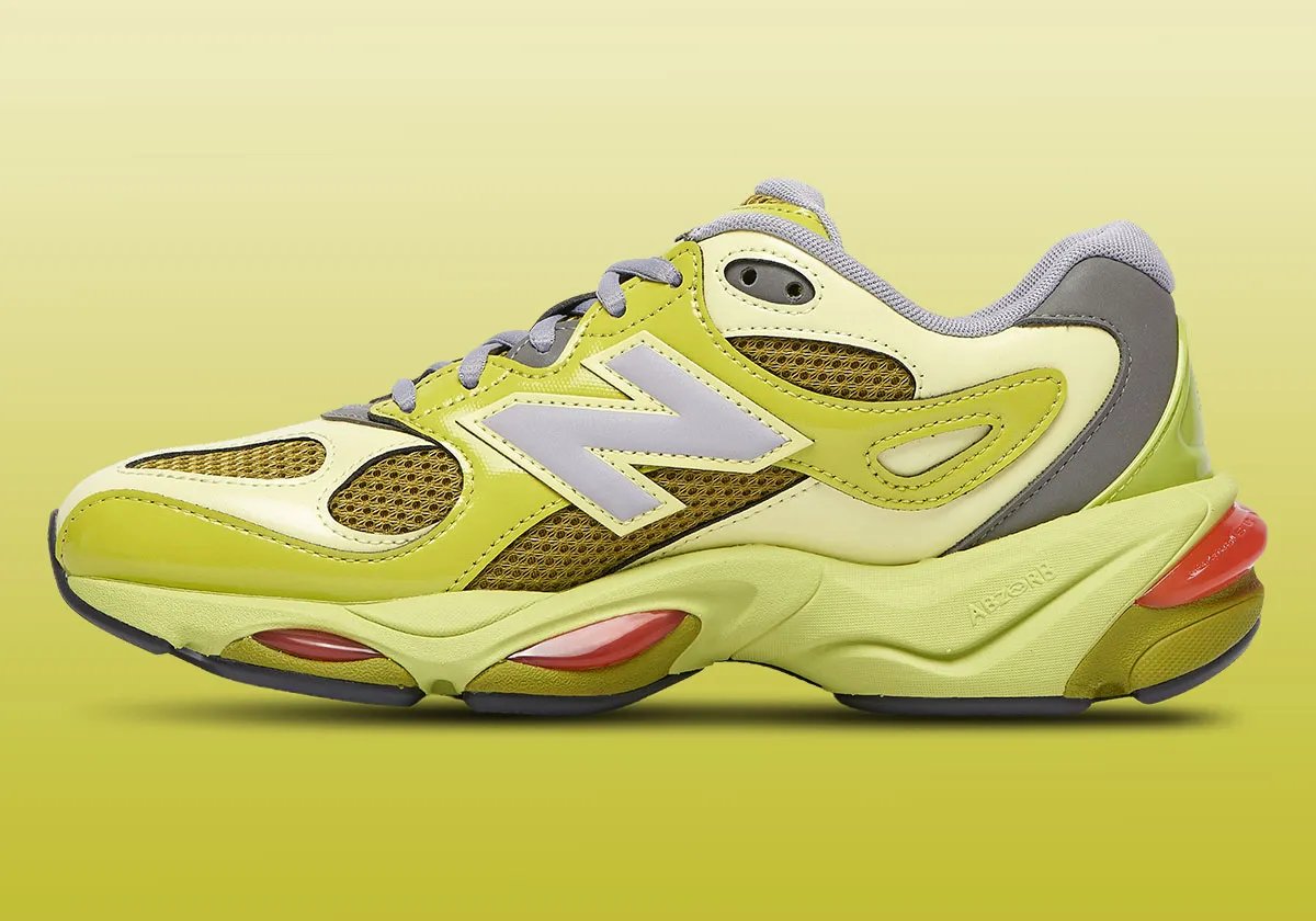 New Balance 983 in dark moss green with patent overlays and red ABZORB cushioning pods, lateral view
