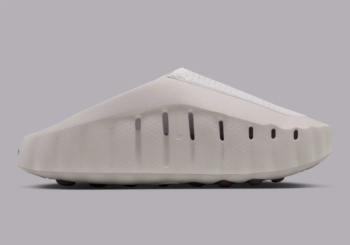 Nike Mind 001 mule in Purple Smoke colorway with Silver Lilac insoles and foam nodes visible on the sole. - detail view 3