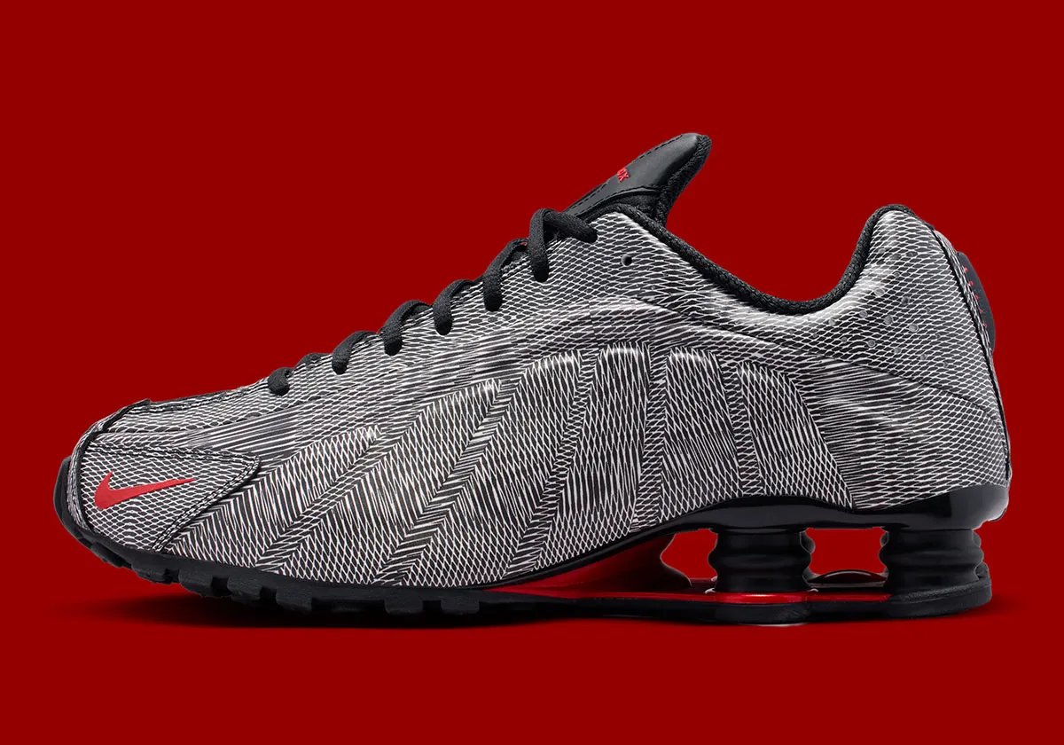 Nike Shox R4 Optical Illusion featuring black and white kinetic patterning across the upper with red mini Swoosh accents - detail view 1
