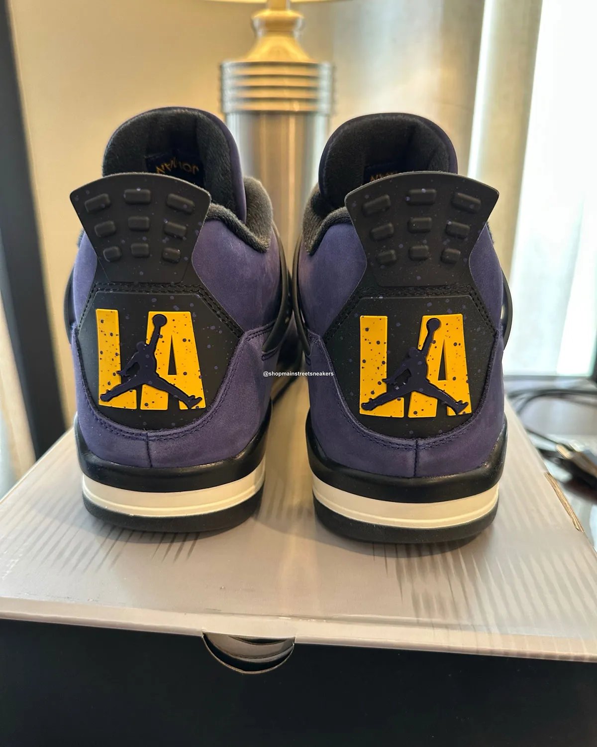 Air Jordan 4 Lakers PE with purple suede upper, golden yellow accents, and custom LA heel branding exclusive to Jordan Brand Classic athletes - detail view 1