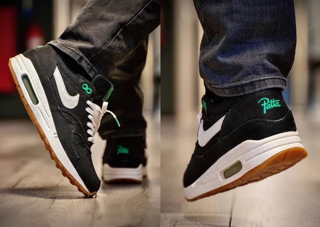 Patta x Nike Air Max 1 Lucky Green in black denim with bright green accents on eyelets and heel branding