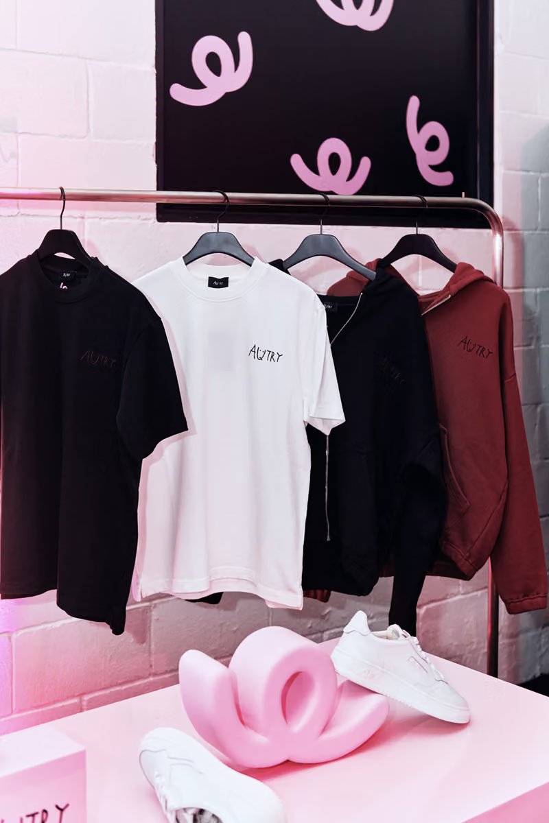 Autry x Changbin capsule collection launch event in Seoul featuring pink-themed venue with reimagined Medalist and Hyperway sneakers displayed on elevated platforms - detail view 3