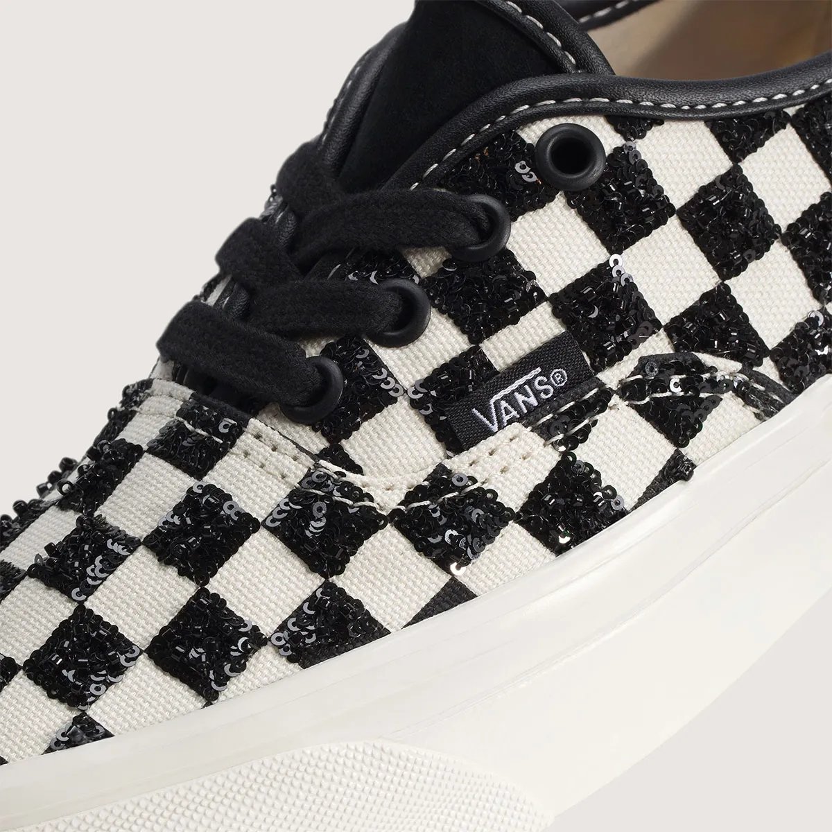 Vans Authentic LX in black checkerboard with sequin embellishment, side view of classic low-top silhouette - detail view 2