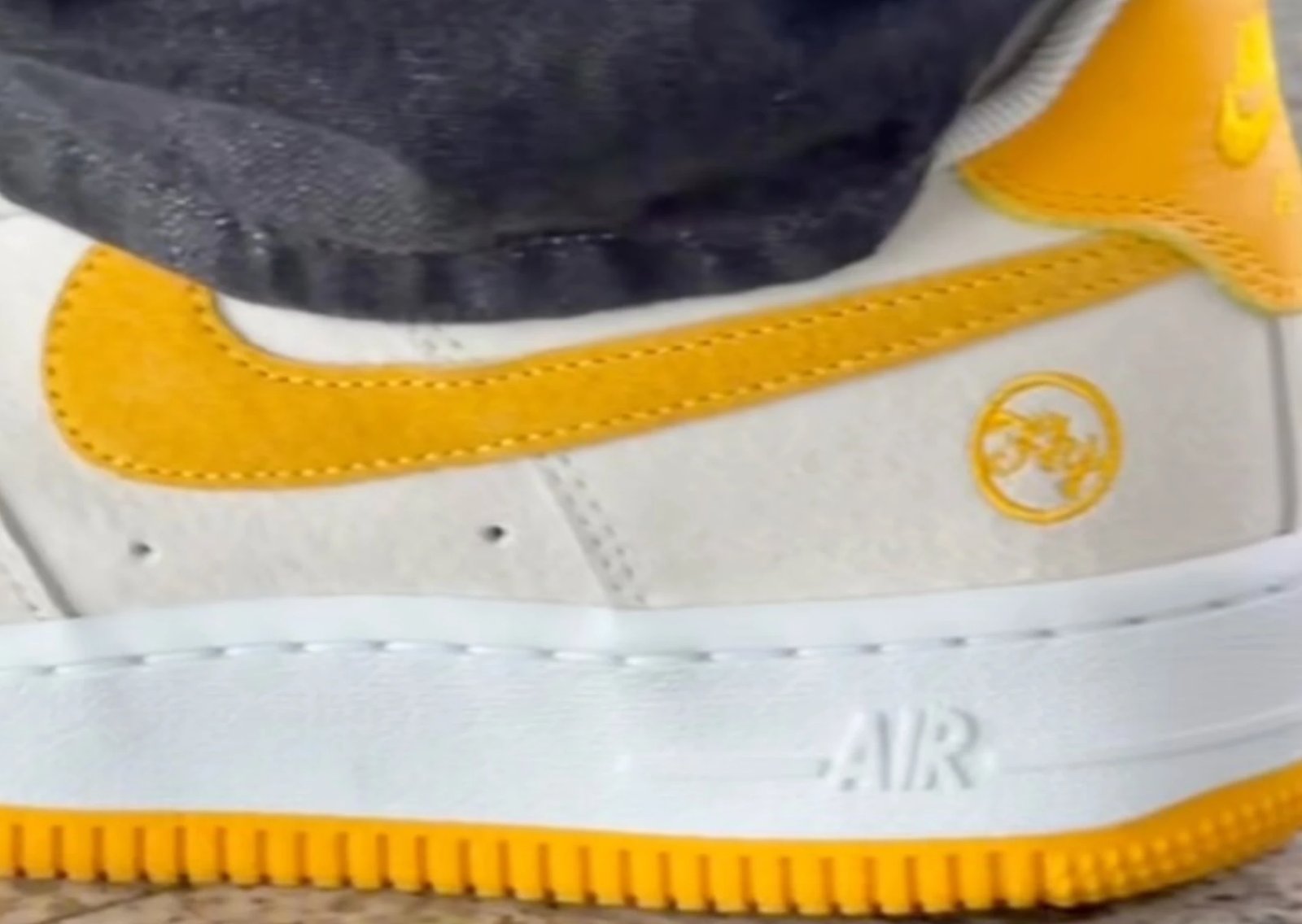 Nike SB Air Force 1 Fly Streetwear collaboration in cream suede with golden yellow Swoosh and heel tab - detail view 1