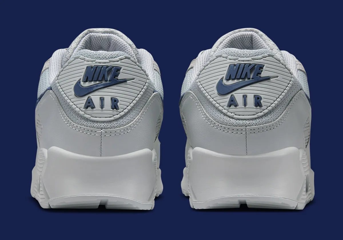 Nike Air Max 90 in team-aligned colorway styled for stadium wear - detail view 4