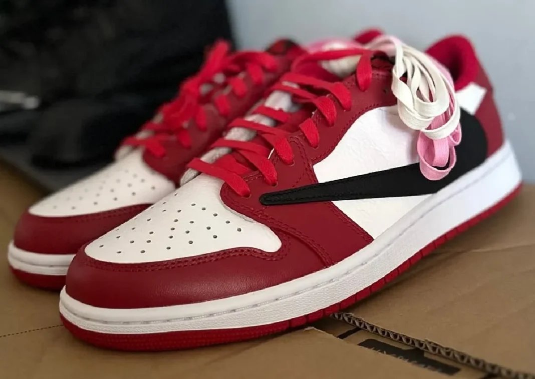 Travis Scott x Air Jordan 1 Low in white, deep red, and black Chicago-inspired colorway, lateral and medial views