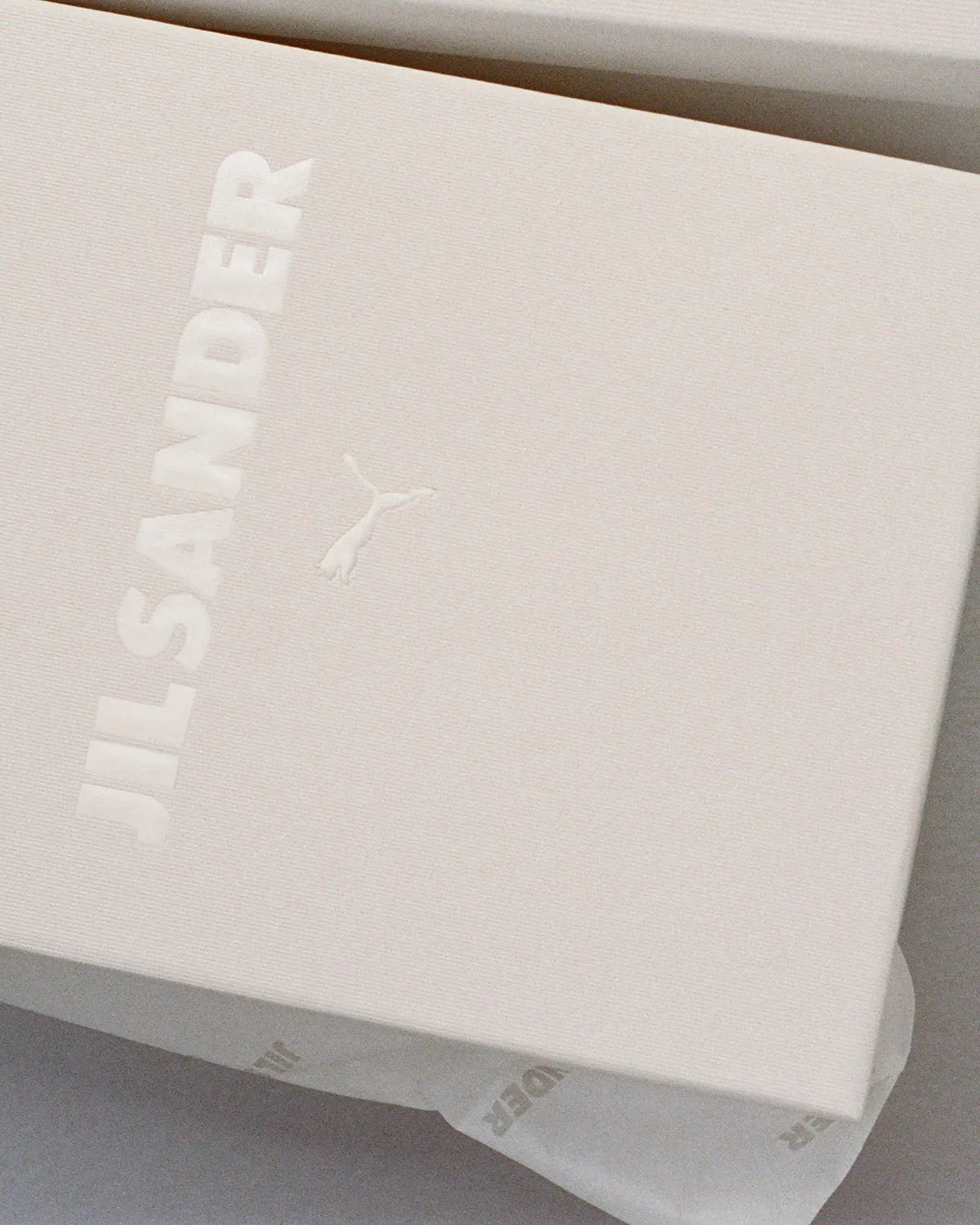 PUMA x Jil Sander K-Street sneaker in blue and navy colorway, showing low-profile sole and layered panel construction - detail view 2