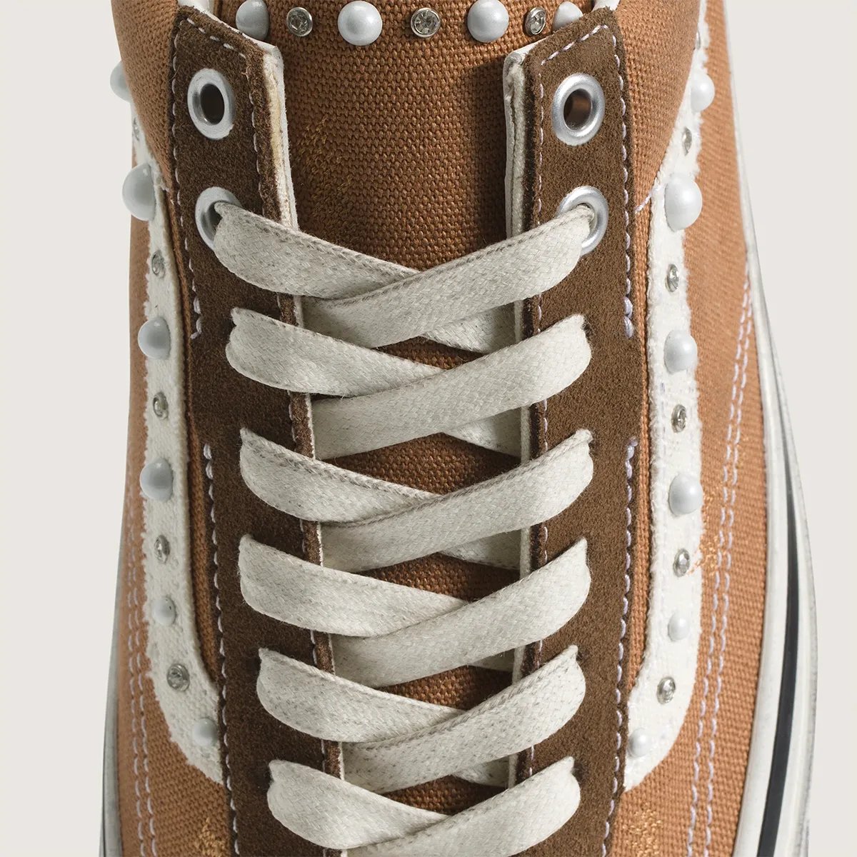 Vans Old Skool in Vintage Cocoa Brown with pearlized finish, showing side profile and iridescent detailing - detail view 3