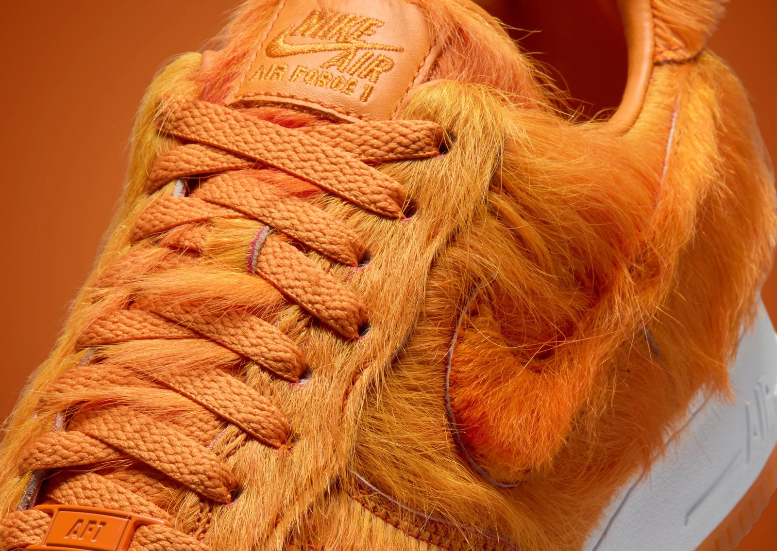Nike Air Force 1 Low Technicolor Tale Orange Pony Hair with thick orange horsehair upper, white midsole, and orange outsole - detail view 2
