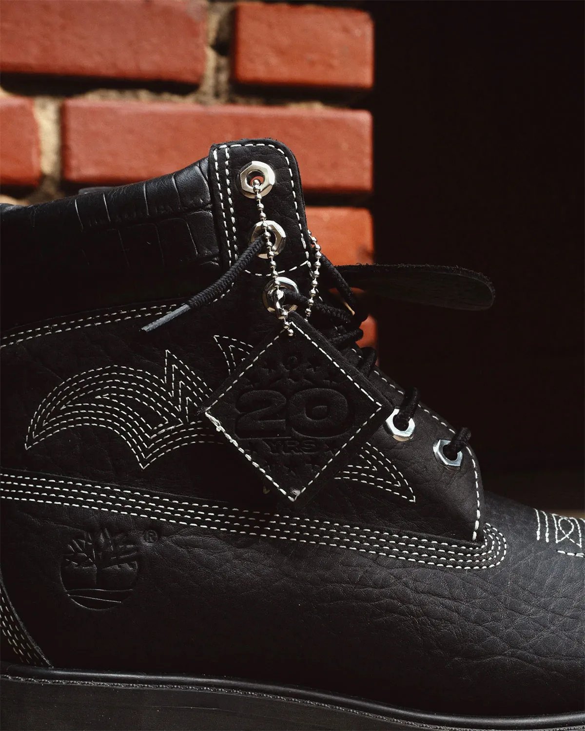 Sneaker Politics x Timberland 6-Inch Boot Outlaw and Rodeo editions featuring pebbled leather, Western stitching, and cow-print detailing - detail view 3