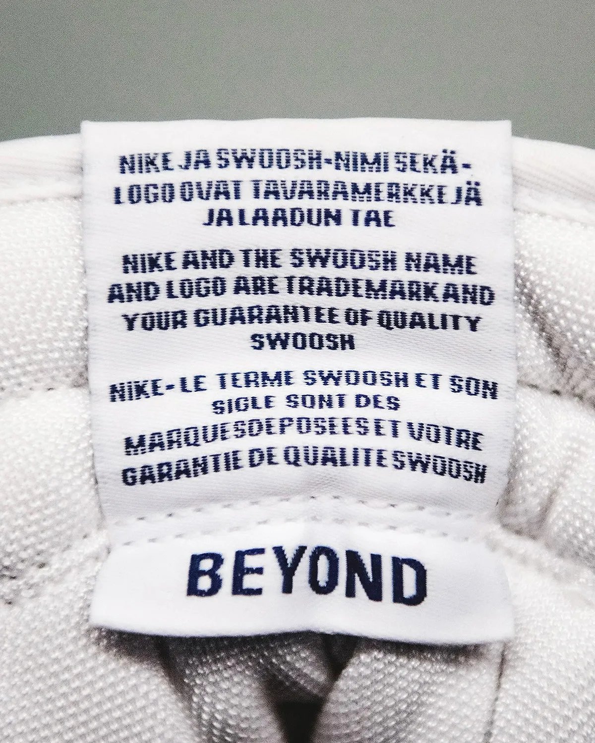 Nike SB Dunk High in white leather and ivory suede with Blue Void patent leather collar, arriving July 2026 via Beyond - detail view 4