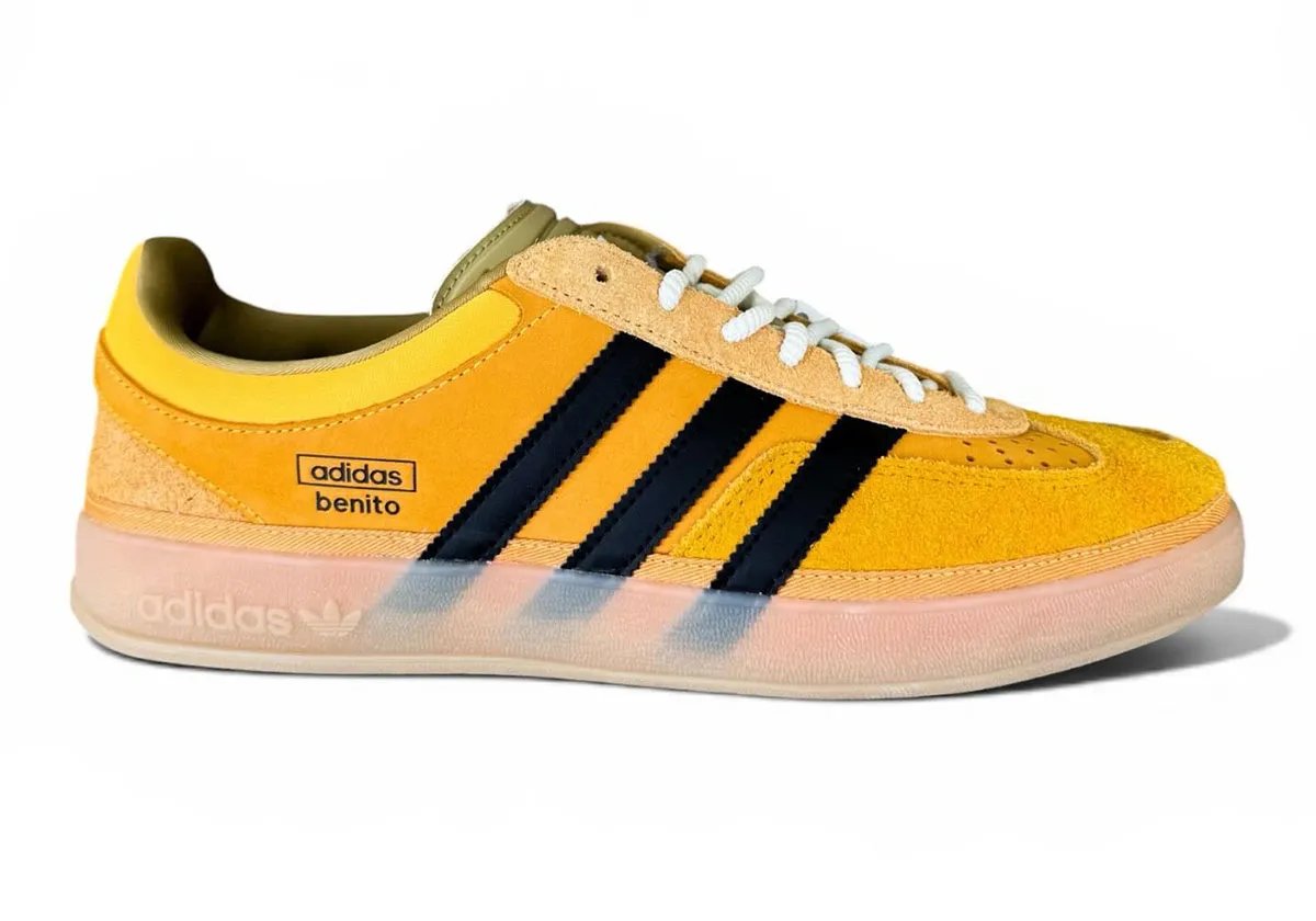 Bad Bunny x adidas Gazelle Indoor in Solar Gold with black stripes, showing canvas foxing and offset T-toe construction - detail view 2