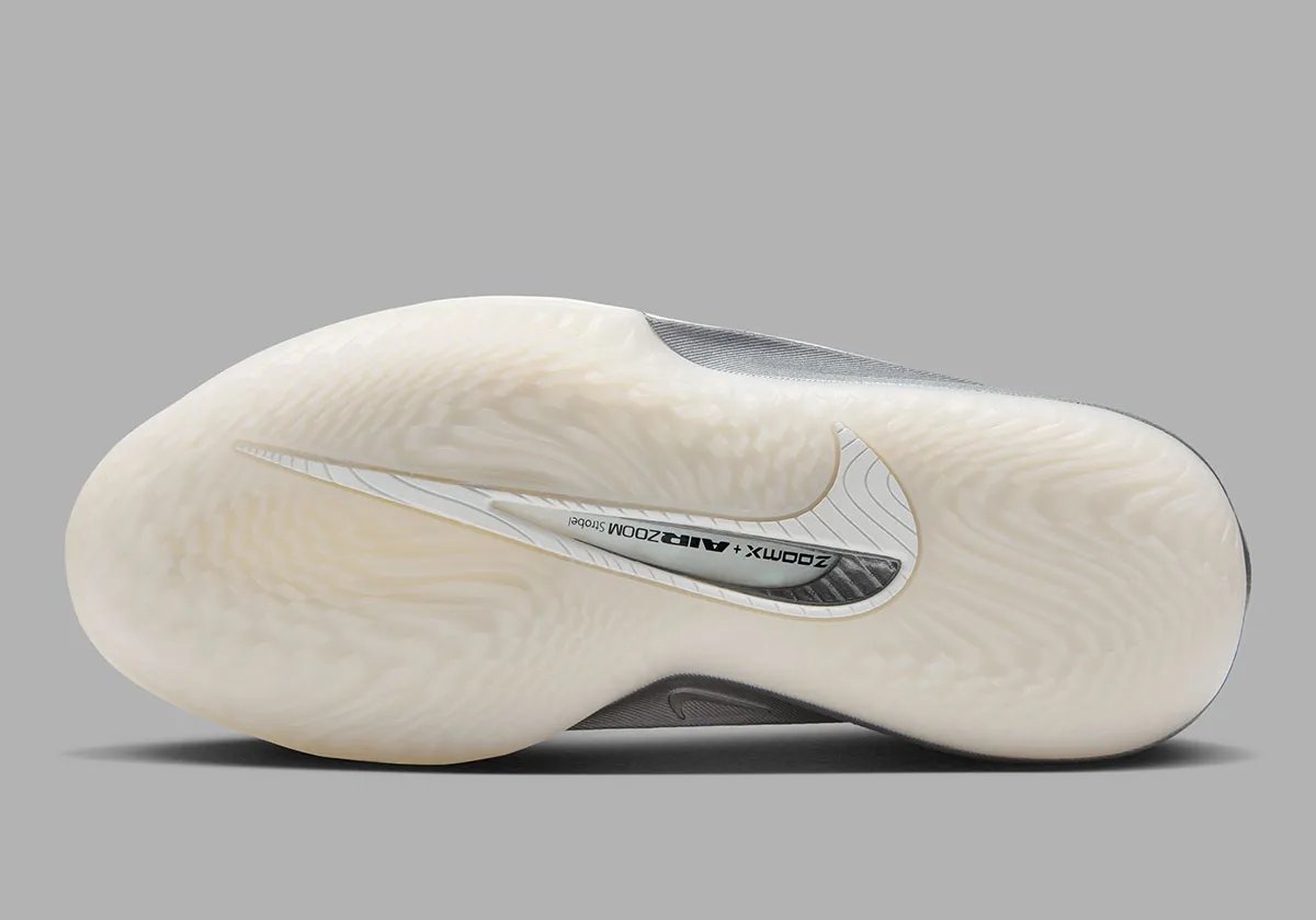 Nike GT Cut 4 SE in Summit White colorway featuring white synthetic upper, black interior, brushed metallic silver heel, and semi-translucent outsole - detail view 2